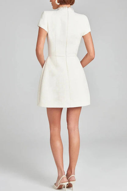 JO | Exquisite and playful tweed fabric beaded short sleeve pocketed mini dress