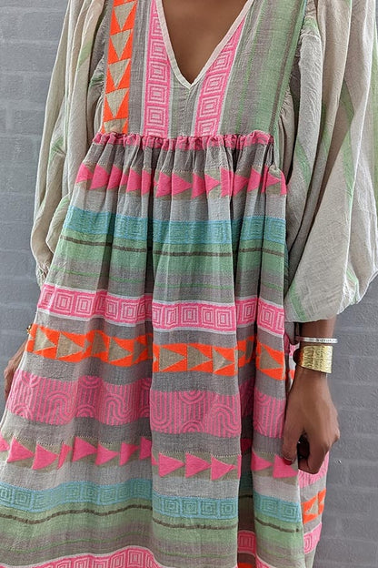 JO | Pink striped midi dress with Greek key and orange necklace