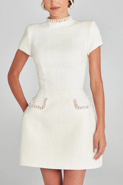 JO | Exquisite and playful tweed fabric beaded short sleeve pocketed mini dress